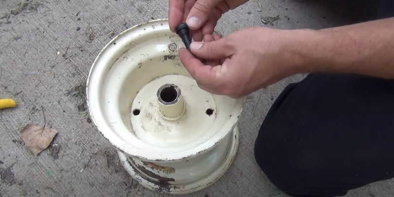 changing a tire on a lawn tractor